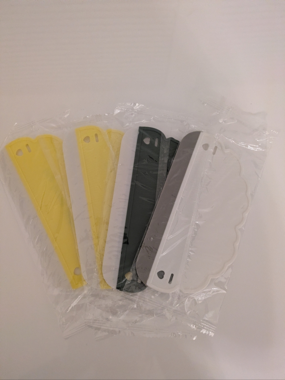 Assorted Plastic Scrapers - Yellow, White, Gray